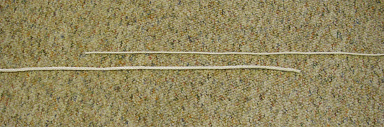 Surgeons-knot-1 Step One: Point eh materials in opposite directions with their ends overlapping.