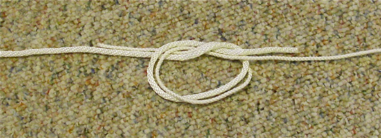 Surgeons-knot-2 Step Two: Tie and overhand knot in the overlapping section.